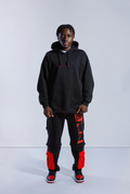Model wearing black Astro Boy 2 Wayz Hoodie and End Credits Astro Boy Trackpants. 