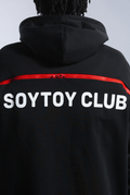Close up of Astro Boy 2 Wayz Hoodie. Large red zipper is closed, and shows white text 'SOYTOY CLUB' underneath