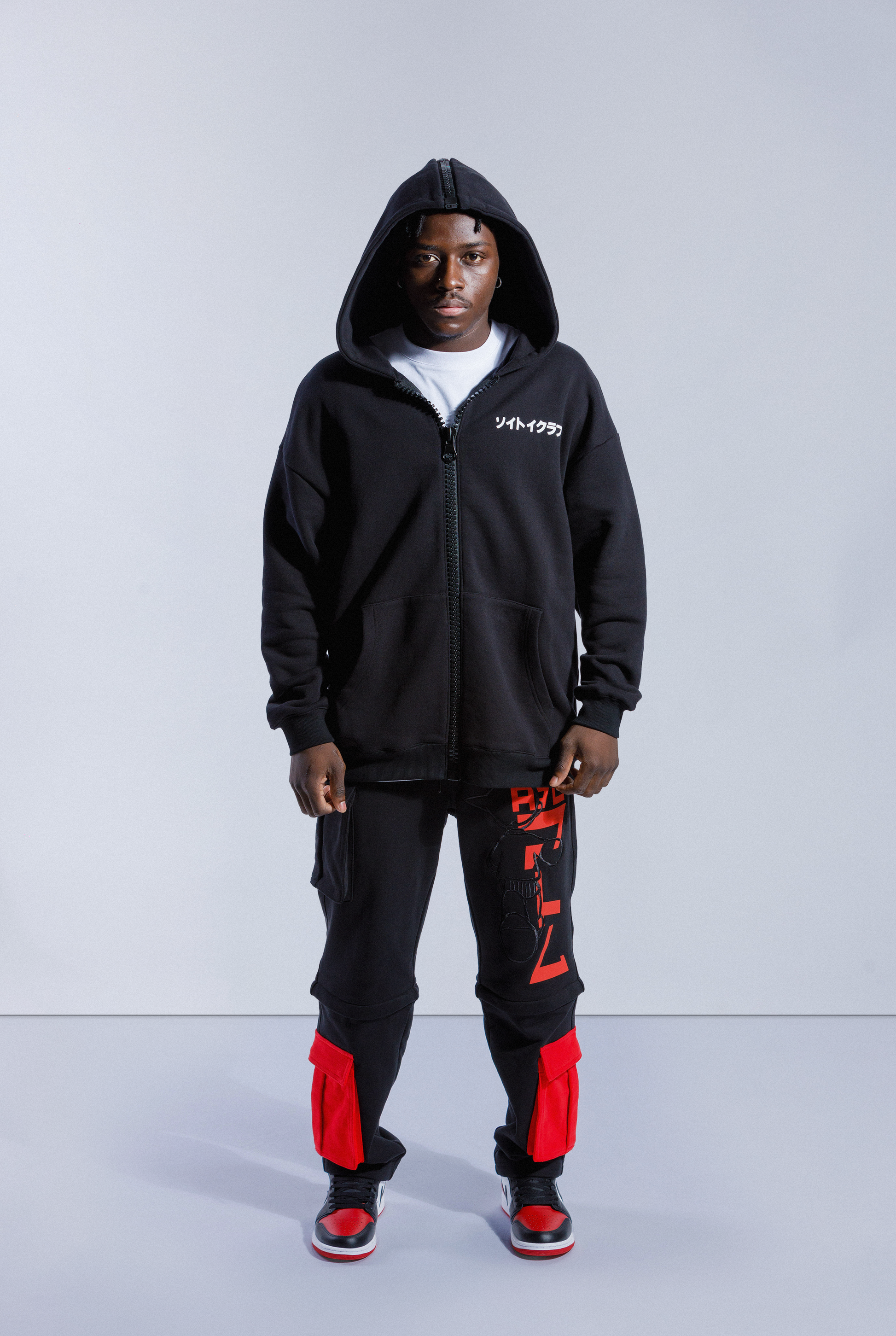 Model wearing black Astro Boy 4 Wayz zip hoodie with hood up