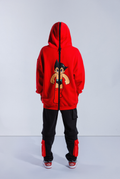 Back of model wearing Red Astro Boy hoodie with large black zip down the middle and hood up