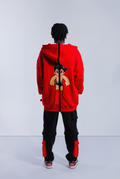 Back of model wearing Red Astro Boy zip hoodie with large black zip down the middle and Astro Boy graphic