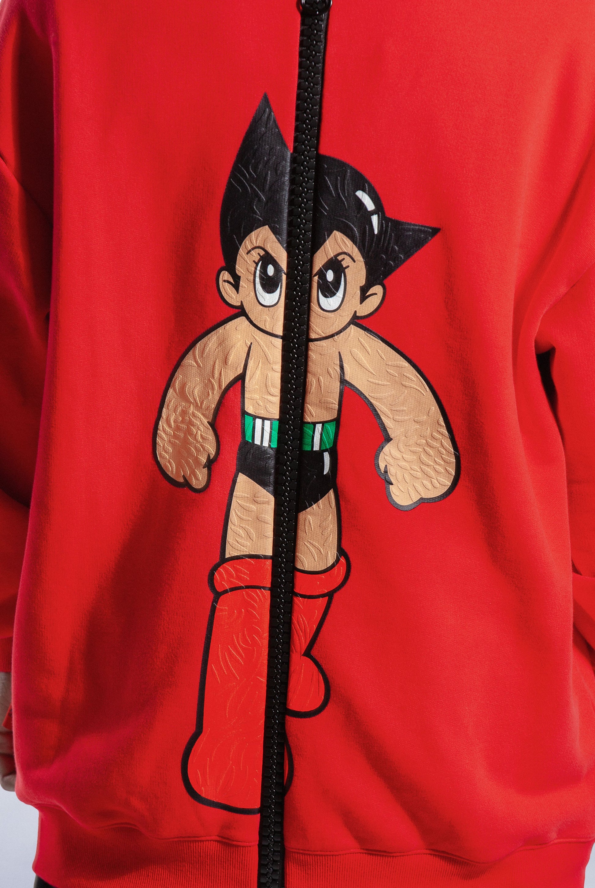 Close up of back of Red Astro Boy 4Wayz Hoodie showing Astro Boy graphic and black zipper
