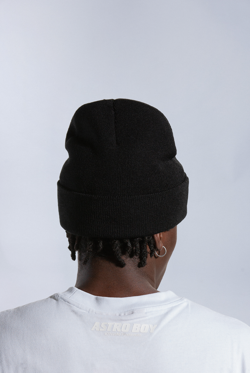 Back of model wearing black Astro Boy beanie 