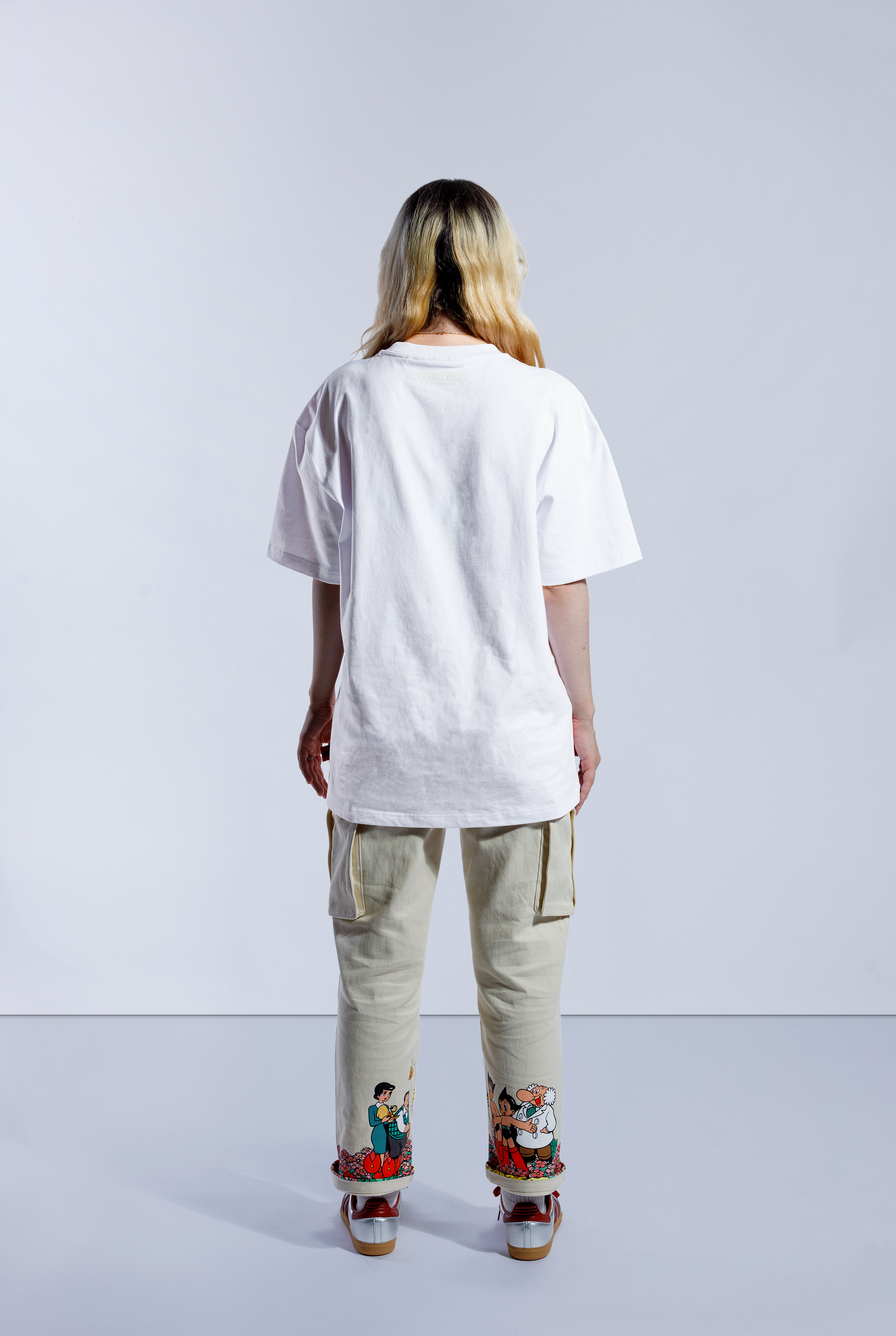Model wearing white Astro Boy Sleepy Box Logo tee.