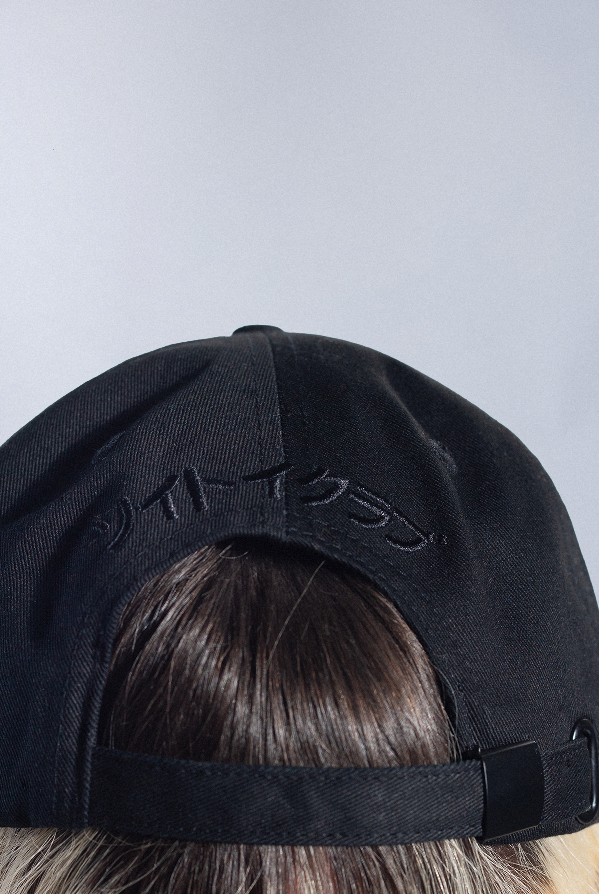 Back of Black Astro Boy Cap with embroidered Japanese text that reads 'Soytoy Club'