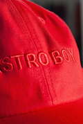 Detail shot of embroidered Astro Boy text on front of Red Astro Boy cap