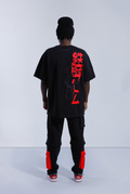 Back of model wearing black Astro Boy End Credits shirt. Large red Astro Boy text in Japanese with an embroidered Astro Boy silhouette over the top