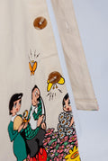 Detail shot of buttons on the front of the Family Portrait shirt and the screen printed Astro Boy graphic