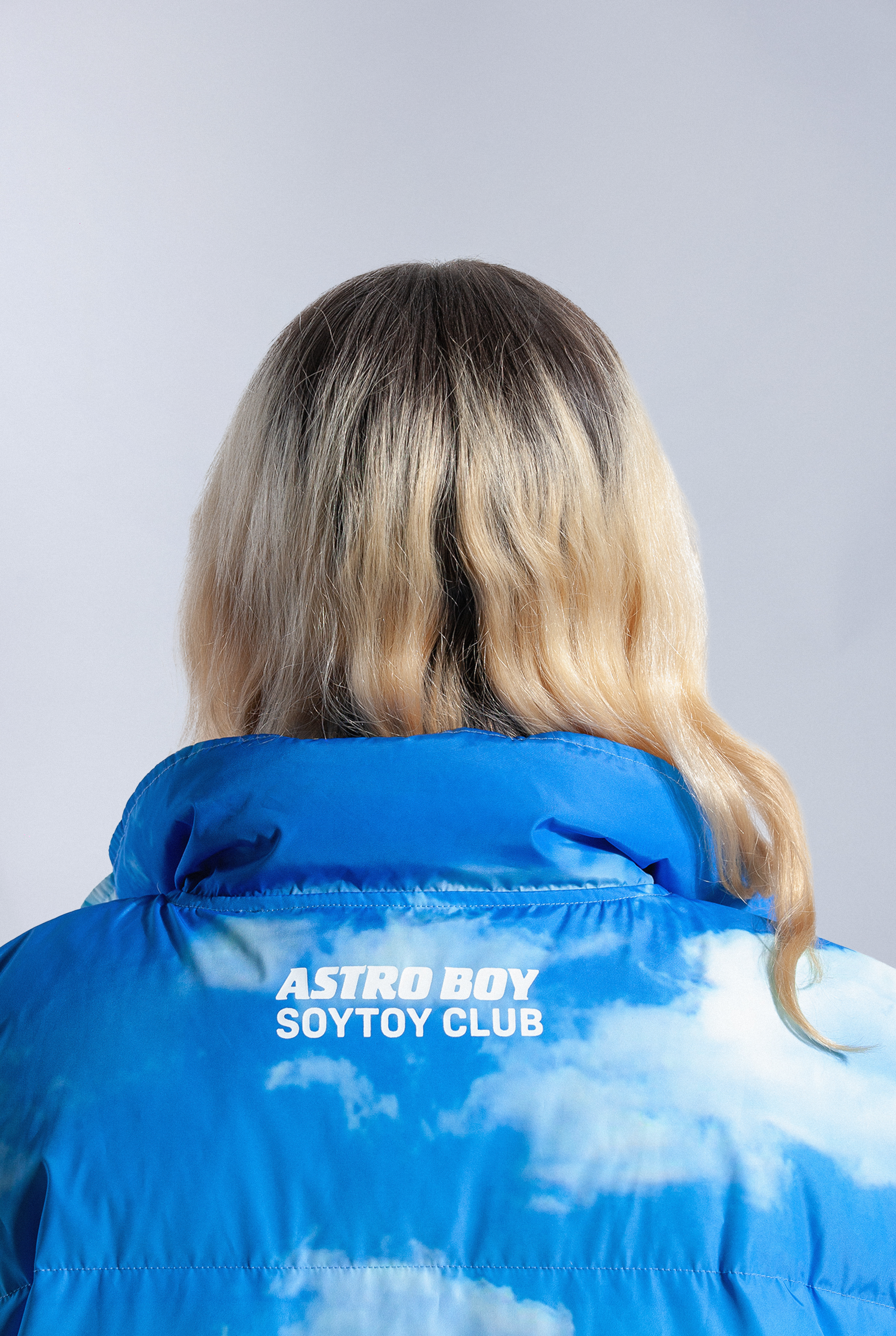 Back of Astro Boy Family Portrait vest showing 'ASTRO BOY x SOYTOY CLUB' Logo printed on back of neckline