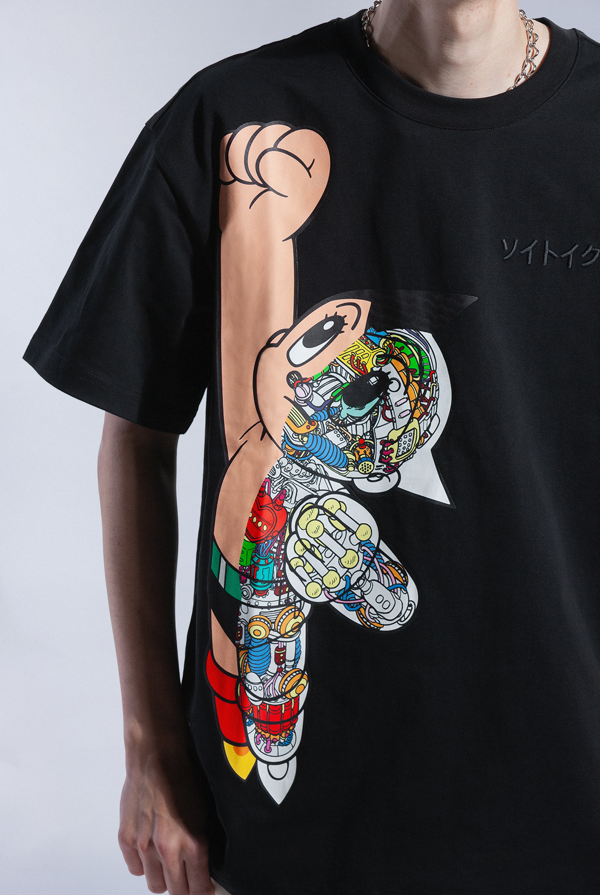 Close up of flying Astro Boy graphic on black t-shirt