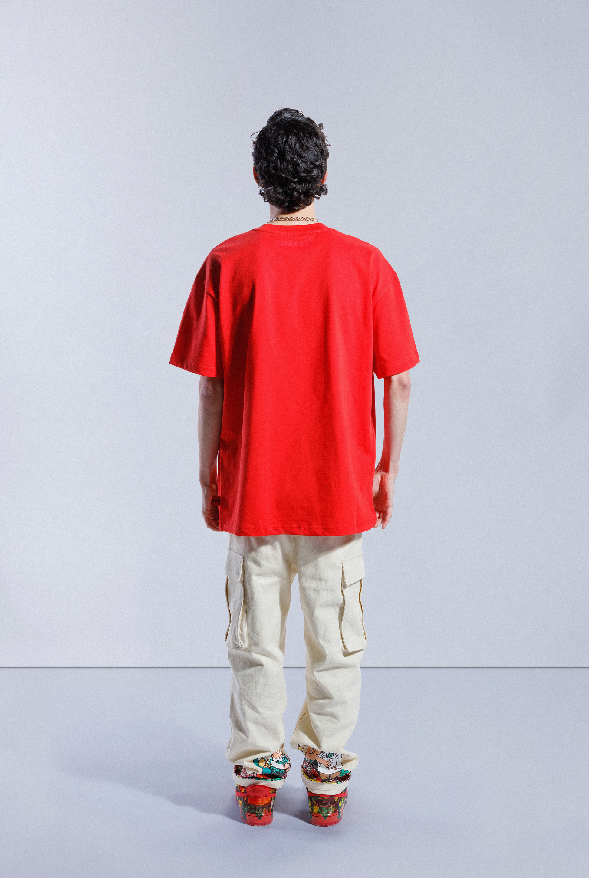 Back of model in Astro Boy Flight Tee.