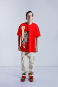 Model wears Red Astro Boy Flight Tee. Large Astro Boy graphic on the left side in a flying motion