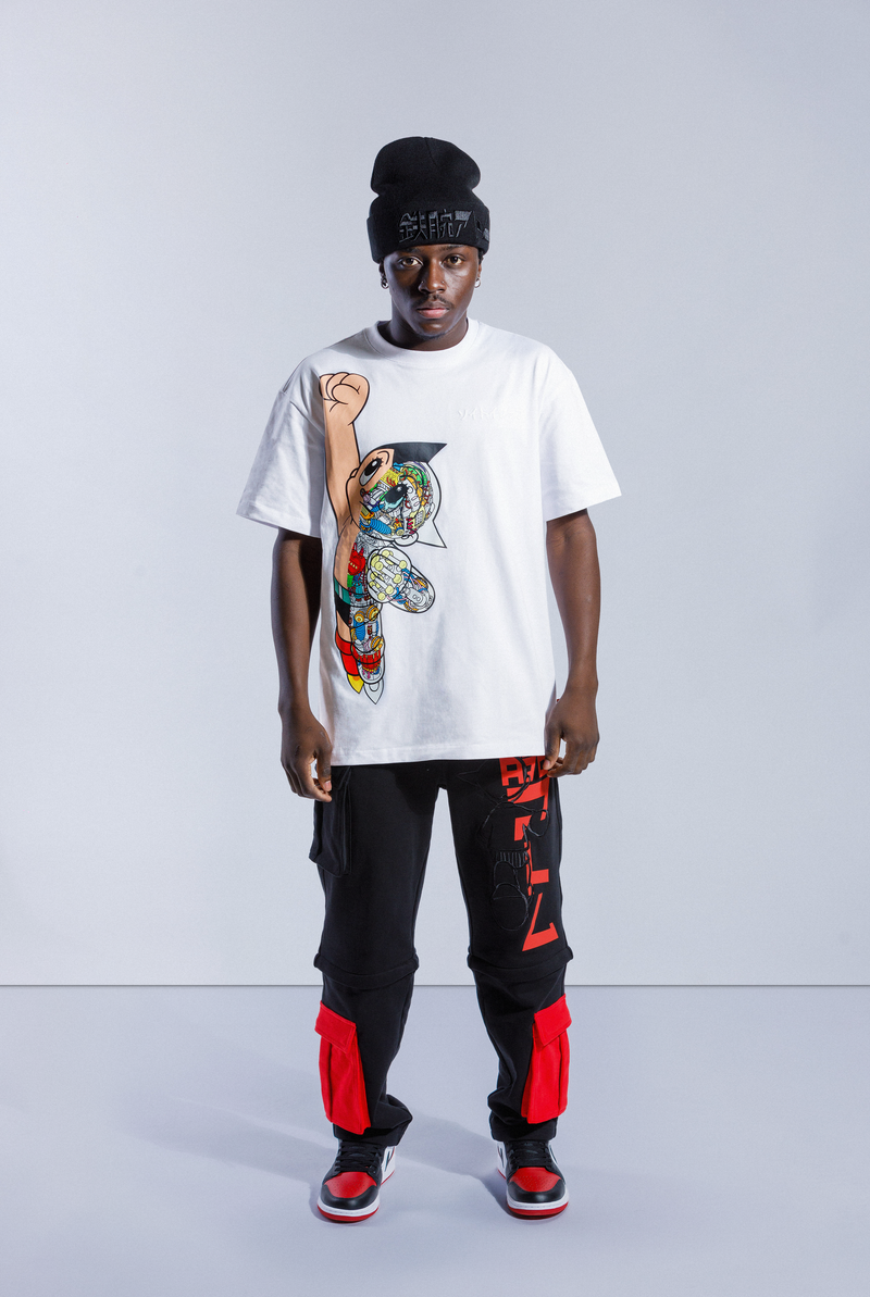 Model wears white Astro Boy Flight Tee. Large Astro Boy graphic on the left side in a flying motion