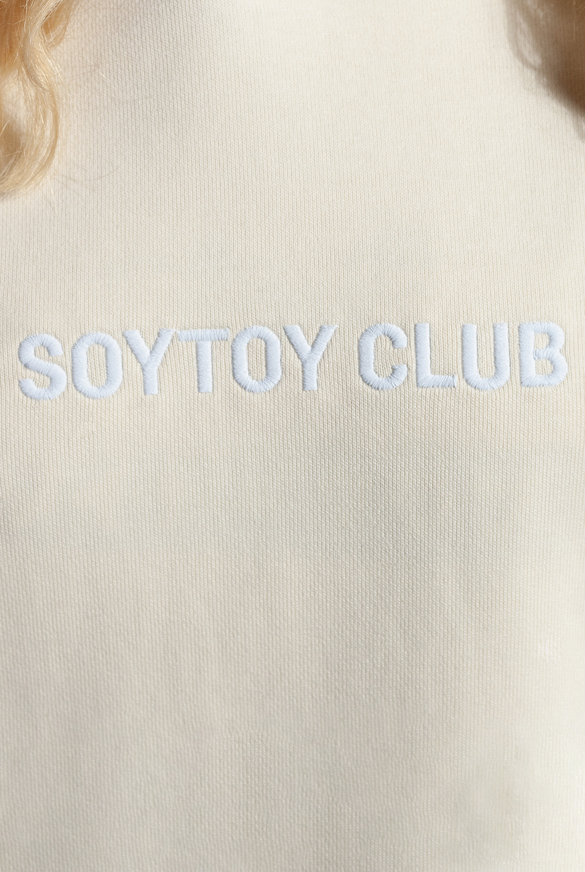 Close up of Sleepy Boi Hoodie front with white embroider SOYTOY CLUB