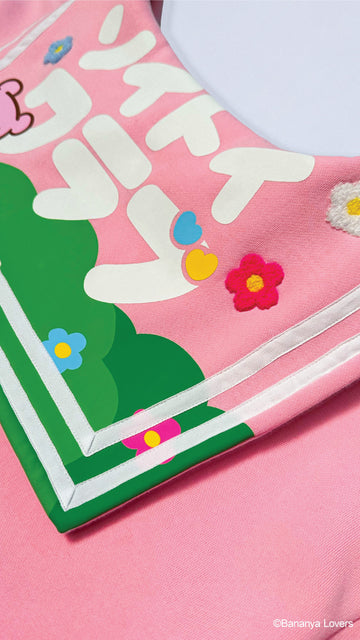 Detail shot of Bananya Seifuku showing Bananya scene on back of sailor flap with Japanese text that reads 'SOYTOY CLUB'