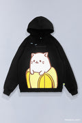 Black SOYTOY CLUB hoodie featuring Bananya the white cartoon cat sitting inside a yellow banana on a light gray background