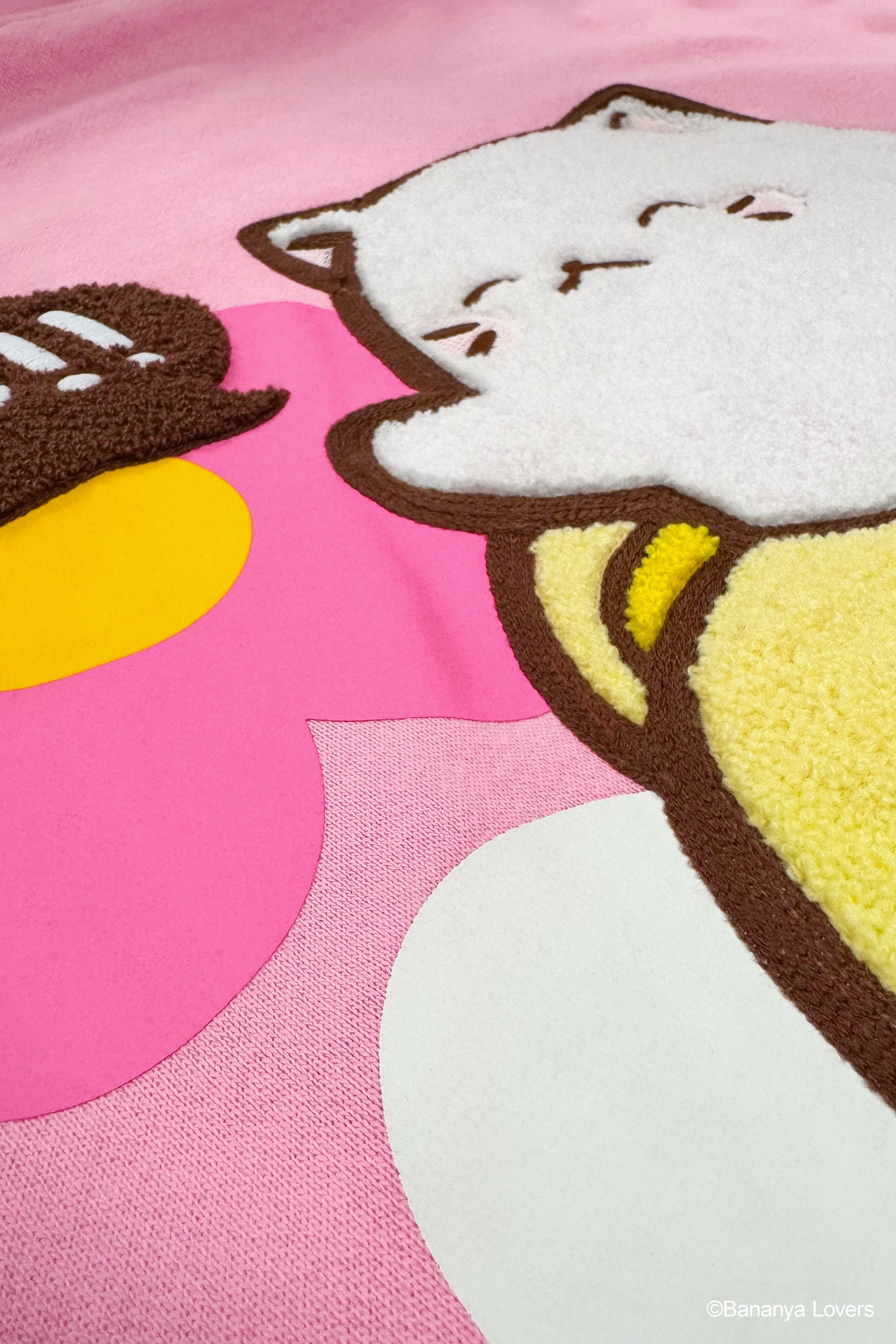 Close up of pink Bananya Flower hoodie showing raised chenille embroider detail of Bananya 