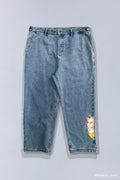 Stone-wash blue jeans that show 3 different Bananya characters stacked on top of each other on bottom left leg