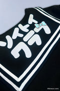 Detail shot of Bananyako Seifuku showing back of sailor flap with text that reads 'SOYTOY CLUB' and an embroidered blue Taremimi Bananya bow