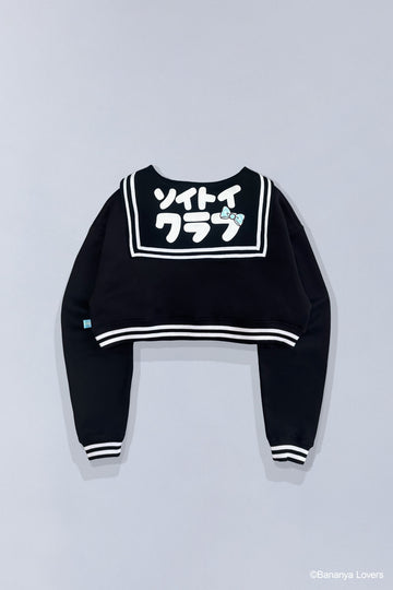 Back view of Bananyako SOYTOY CLUB cropped Seifuku sailor-style sweater. Sailor flap has Japanese text that reads 'soytoy club' with a Taremimi Bananya bow on it