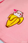 Close up of embroidered Bananya design on pink skirt