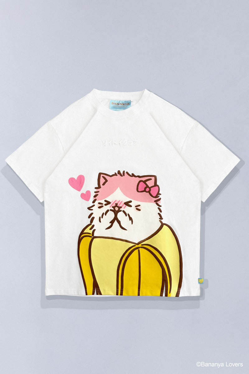 Front of white Bananyako t-shirt. Has large graphic print of Bananyako the white and pink Bananya cat in a yellow banana